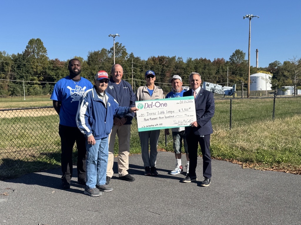Pictured L-R: from Dover Little League: Baseball Director Videll Slade, City Liaison Director Ed Coker, President Bill Kinsey, Concessions Director Mary Pritchett, Equipment Director Ralph Pann, & Del-One’s President & CEO Dan McCarthy